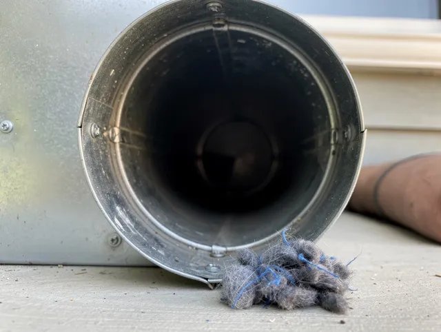 Milford city  Dryer Vent Cleaning technician using specialized equipment to clear severe dryer vent blockage in Milford city 